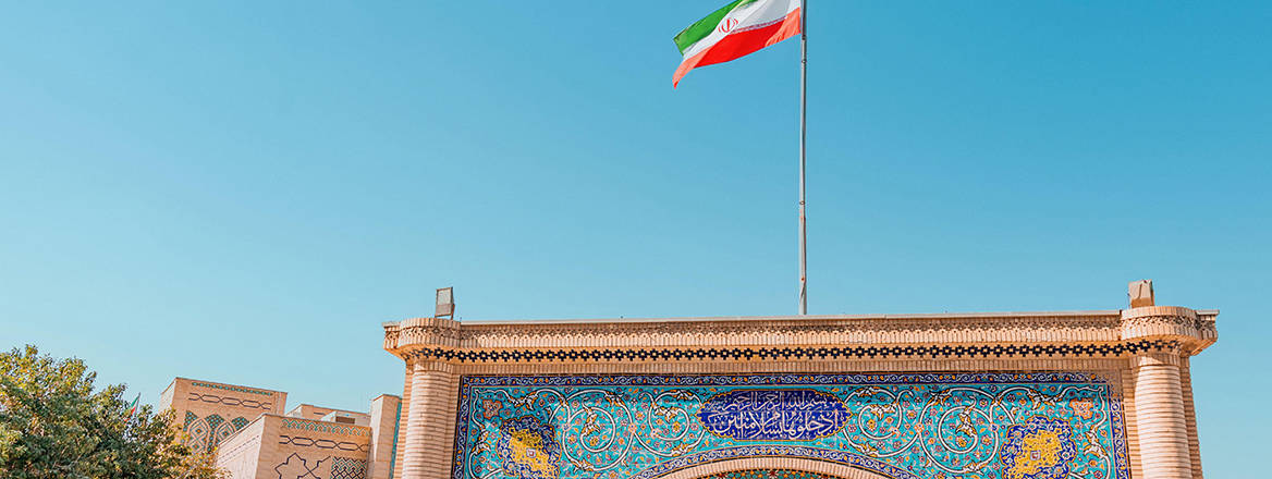 Iran's flag waving above the Iranian Embassy in Doha, Qatar.