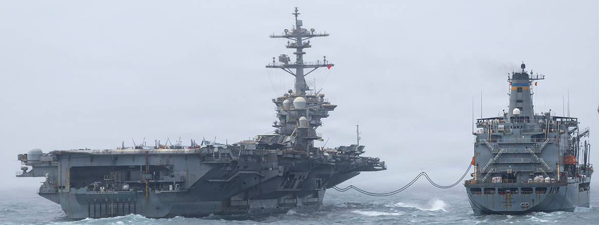 USS Abraham Lincoln conducts replenishment-at-sea with USNS Henry J. Kaiser while in the US 5th Fleet area of operations.