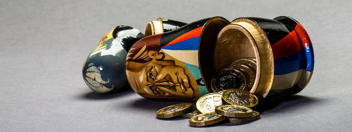 A concept image of a matryoshka doll with pounds coins inside.