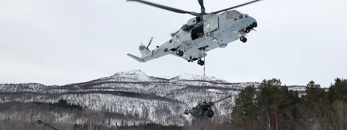 845 Squadron Merlin Mk4 lifts off with an underslung load comprising of a 29 Commando Regiment Royal Artillery 105mm Light Gun during a load lifting training exercise in Northern Norway.