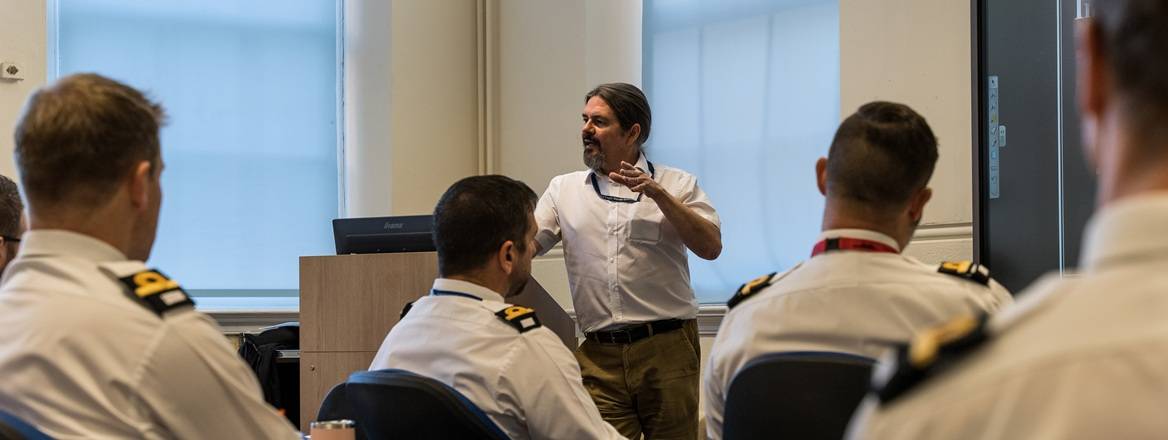 Early career naval officers being lectured by embedded university staff