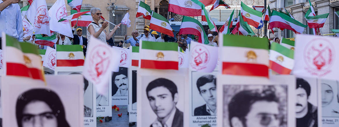 Photos of political prisoners killed by the Iranian regime in 1988 are on display in Piazza Santi Apostoli in Rome, 30 July, 2025.