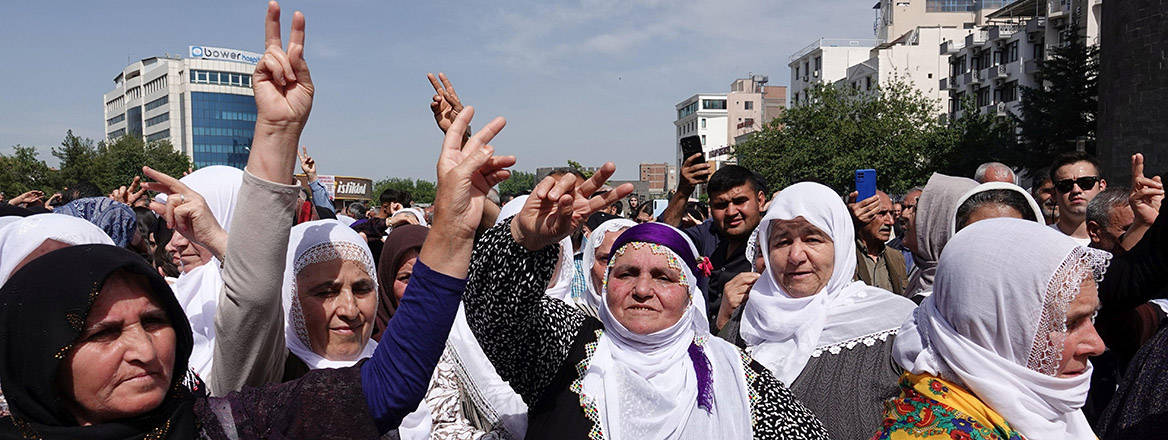  A group of Kurdish women are seen making the victory sign at a commemoration ceremony in Diyarbakir, Turkey, 18 May 2025.