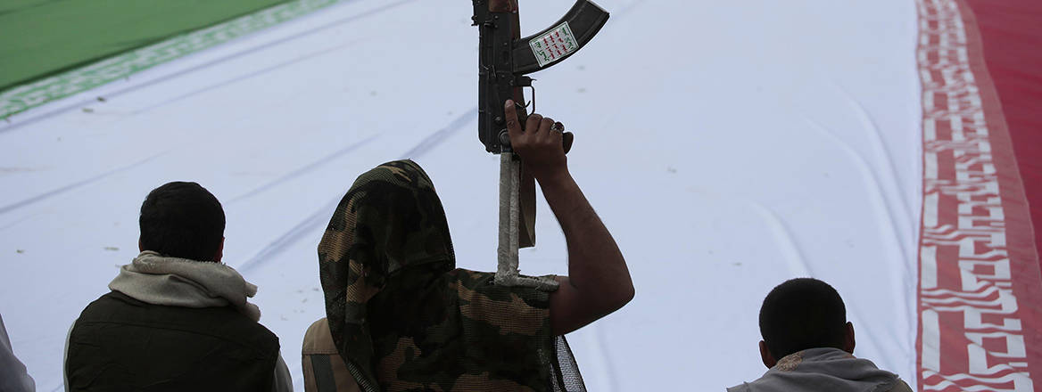 Houthi supporters with a giant Iranian flag in Sana’a, Yemen, 2025. Courtesy Alamy/Osamah Abdulrahman