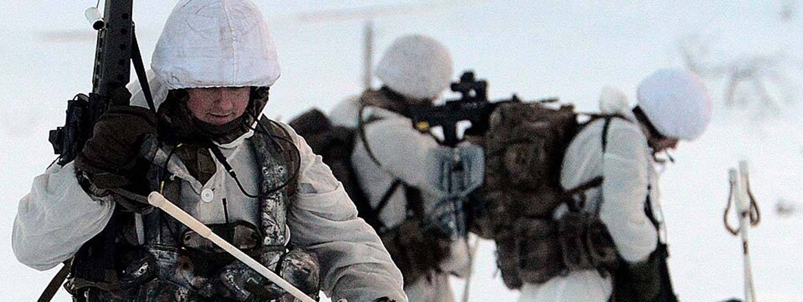 Royal Marines conducting live firing break contact drills in Norway.