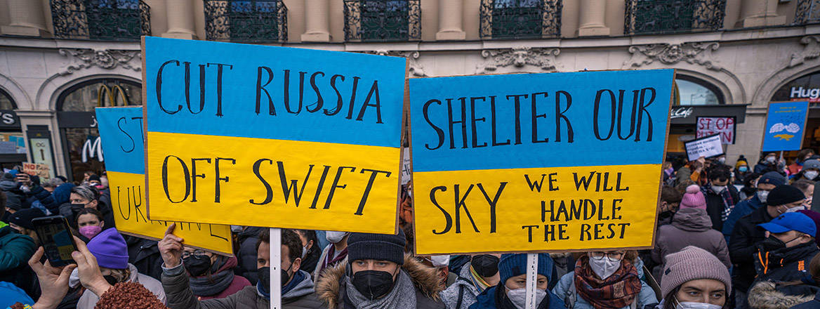 A crowd calls for sanctions against Russia after the war was launched in Ukraine.