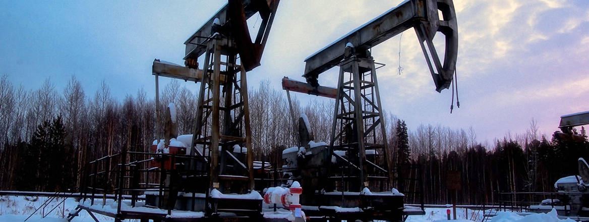 Abandoned and finished oil field in Russia during the winter period.