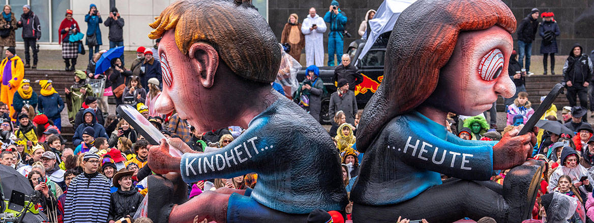 Jacques Tilly's float, focusing on smartphone addiction, at the Rosenmontag parade in Düsseldorf.