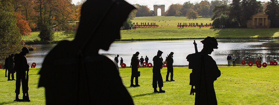 Metal soldier silhouettes form the Standing With Giants Remembrance Day art installation at the NT Stowe Gardens, Buckinghamshire.