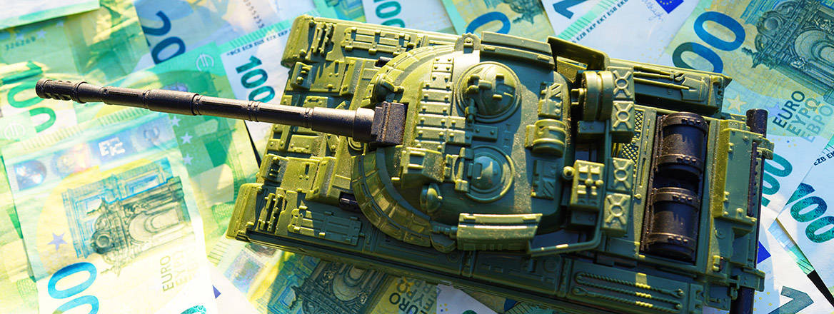 Stock image of a tank on background of banknotes.
