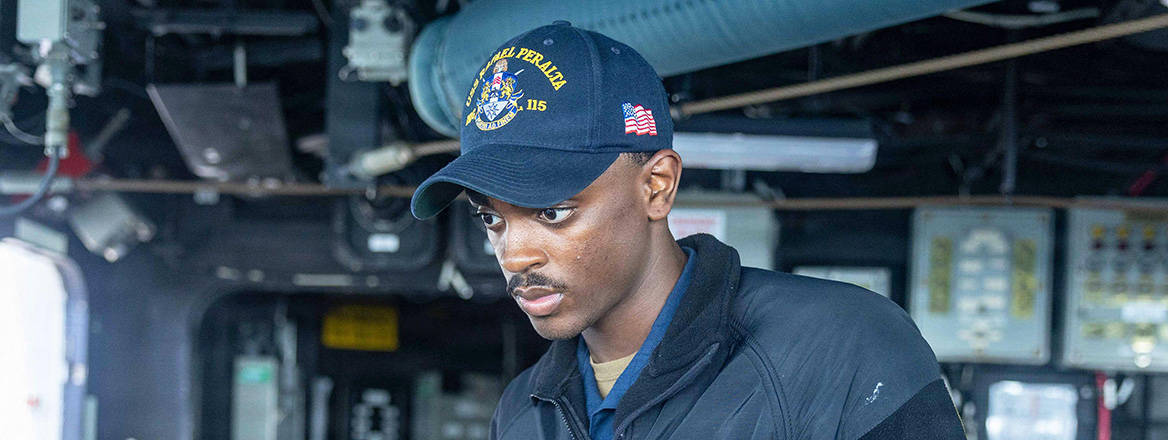 A US Sailor monitors the ship's track on the bridge of the USS Rafael Peralta (DDG 115) during a maritime blockade against ships entering or exiting Iranian ports and coastal areas.