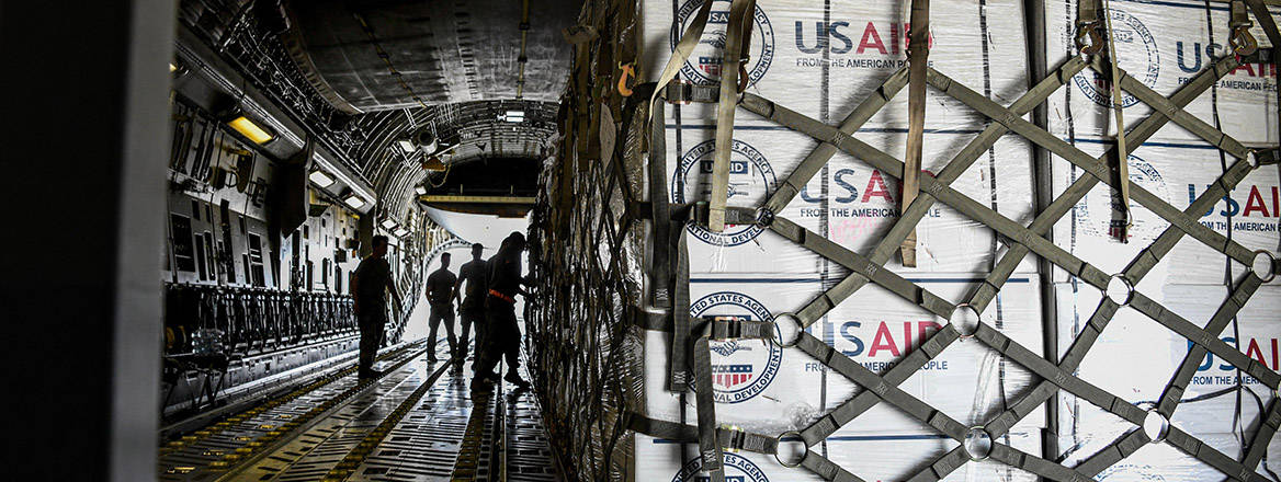 Humanitarian aid from the US Agency for International Development is loaded onto a C-17 Globemaster assigned to the 379th Air Expeditionary Wing.