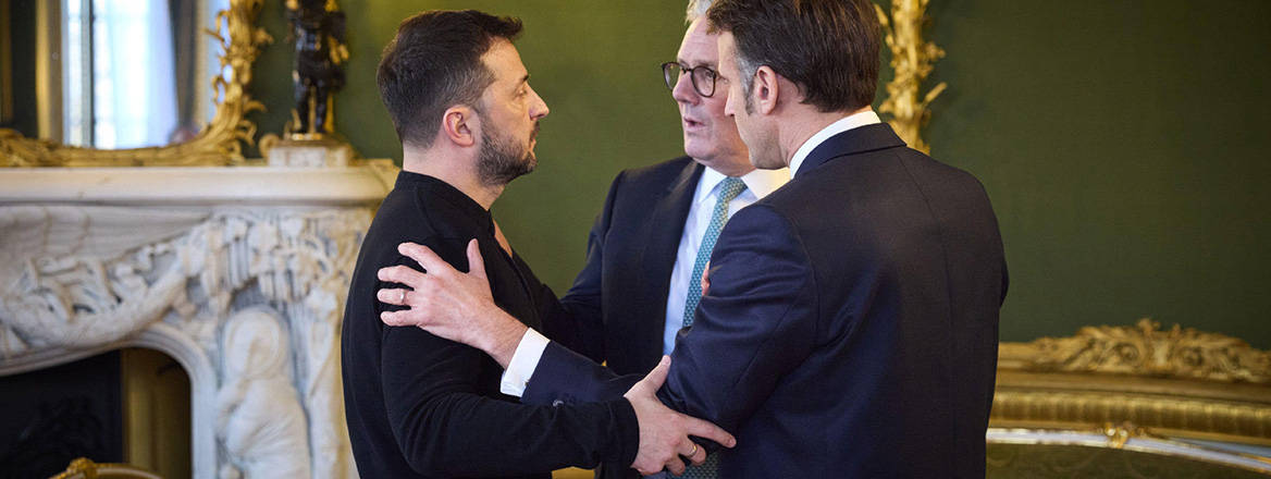 Ukrainian President Volodymyr Zelenskyy, left, is embraced by French President Emmanuel Macron, right, and British Prime Minister Keir Starmer, center, during a meeting on the sidelines of the European Defence Summit at Lancaster House, March 1, 2025 in London, United Kingdom.