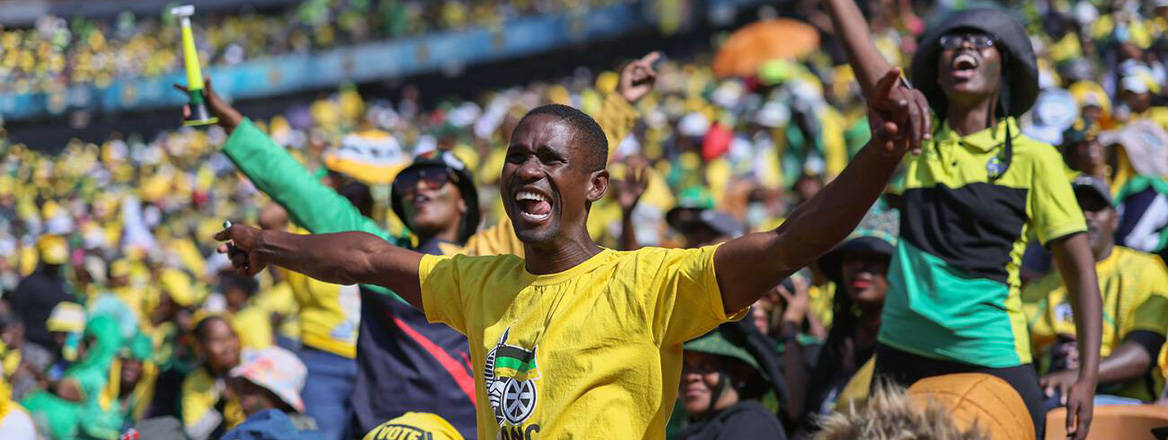 Fired up: supporters chant and wave flags during the final African National Congress rally before the national election