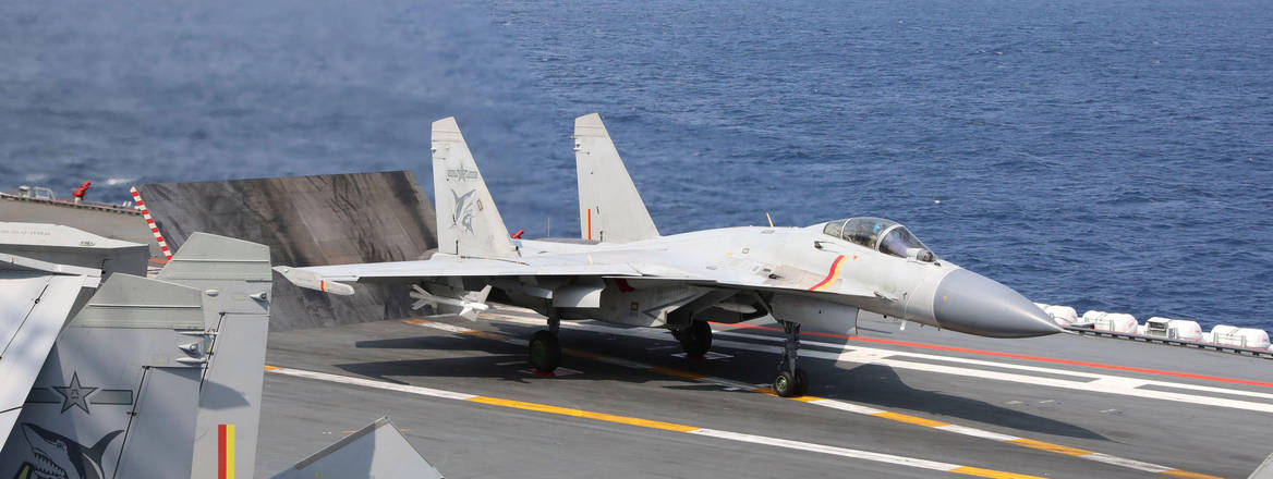 A J-15 Chinese fighter jet prepares to take off from the Shandong aircraft carrier
