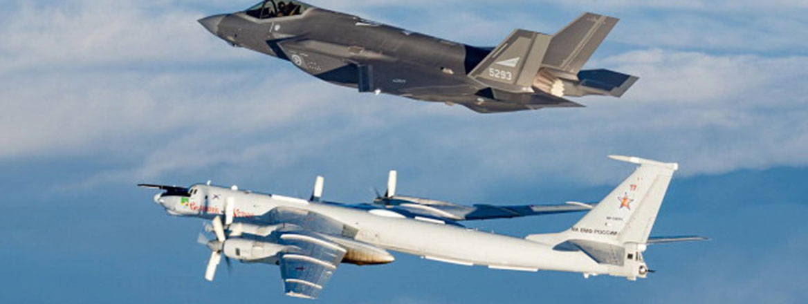 Norwegian F-35 in flight next to a Russian TU-95ms