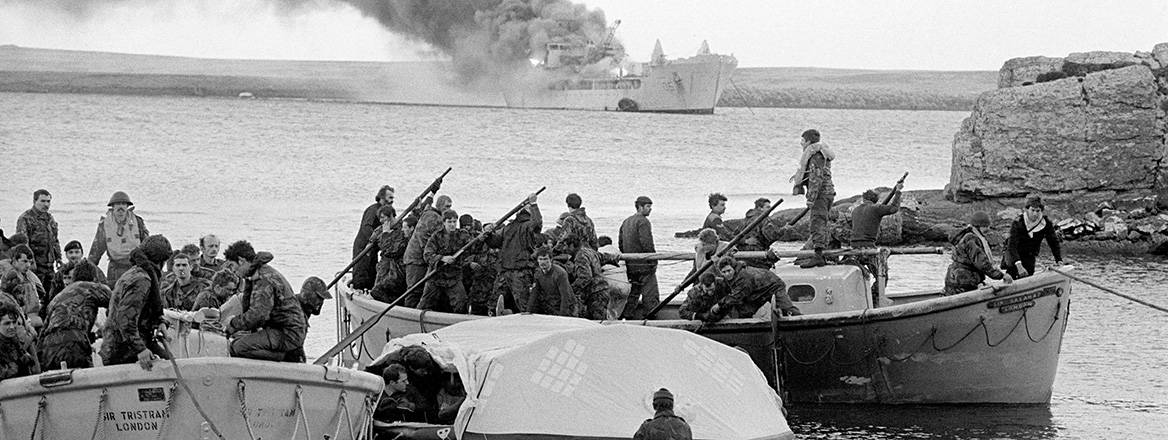 Survivors coming ashore from Sir Galahad, after it was hit by an Argentinian air attack at Bluff Cove, the Falkland Islands. Courtesy of PA Images / Alamy Stock Photo