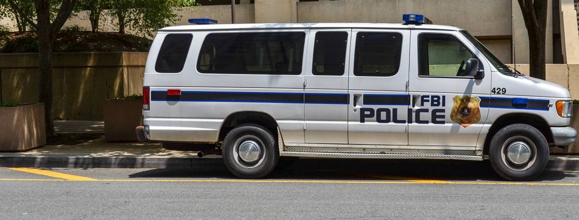 parked fbi police van