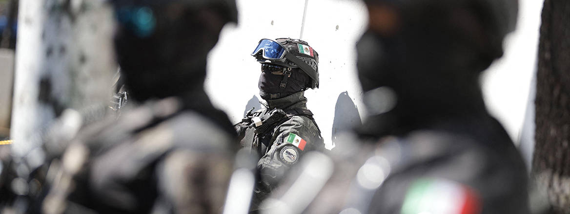 Security personnel guard on a street in Mexico City, Mexico, 23 February 2026. Courtesy of Xinhua/Alamy.