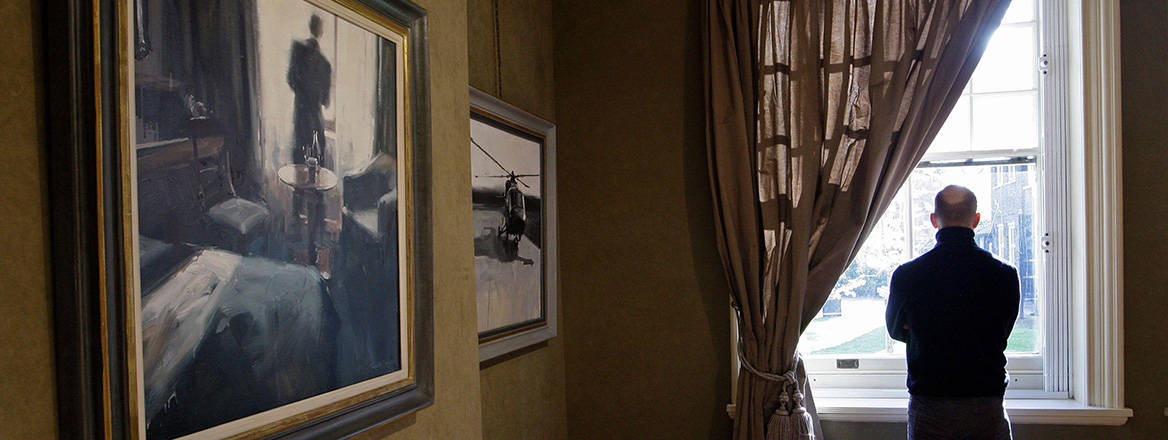 Secret world: artist James Hart Dyke poses by his painting 'Waiting in the hotel room', one of a series of artworks created during a year embedded with the UK's MI6 intelligence agency