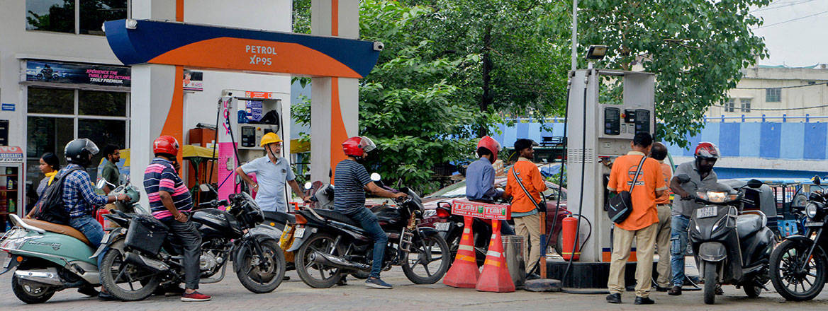 Motorcycle riders wait to refuel their vehicles at a petrol station in India, May 2026. Courtesy of Sipa US/Alamy