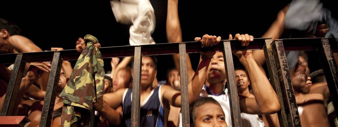 kids behind fence pleading for help
