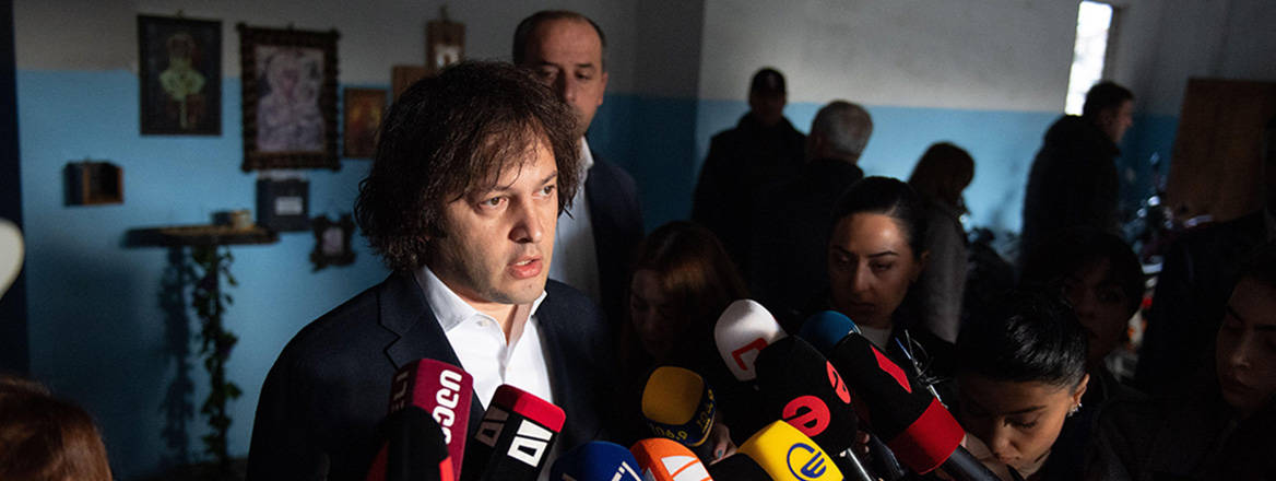 Spinning the narrative: Georgian Prime Minister Irakli Kobakhidze talks to press after casting his vote in the elections on 26 October 2024