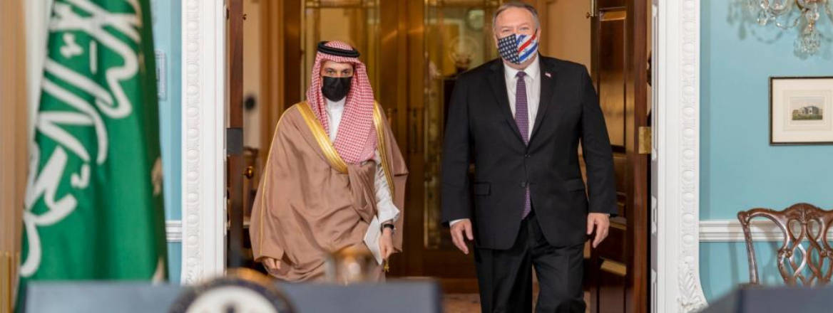 Mike Pompeo walking next to Faisal bin Farhan Al Saud