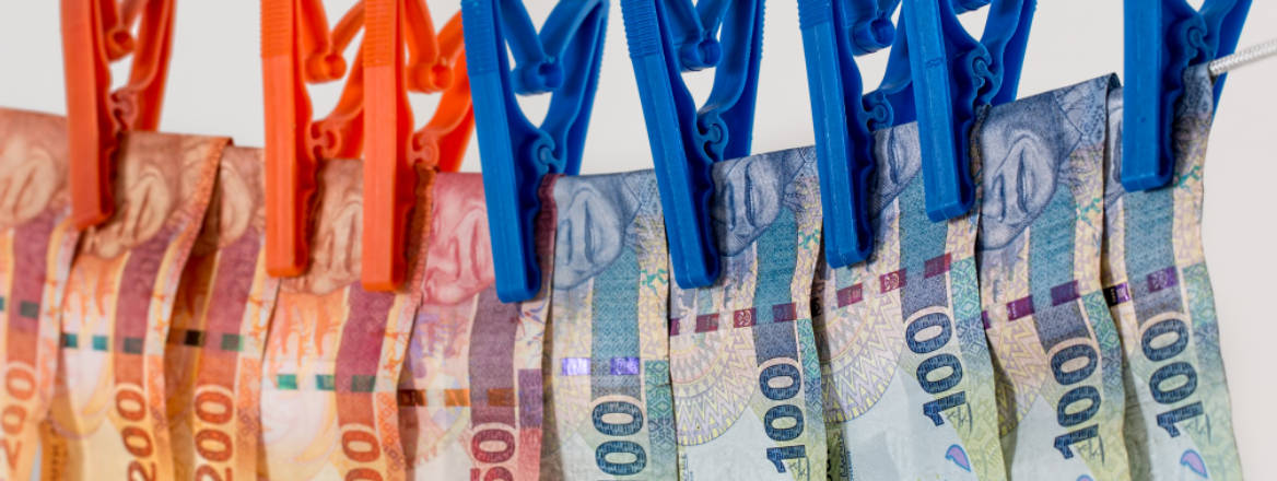 money hanging on pegs