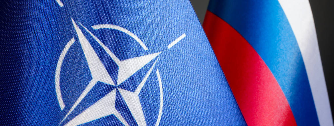 NATO and Russian flags, juxtaposed