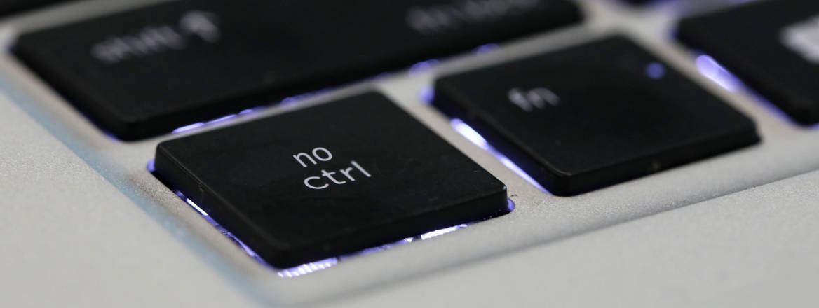 Corner edge of a computer keyboard with 'no ctrl' written on the 'ctrl' key