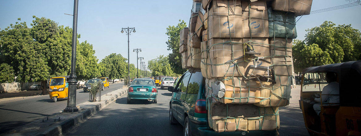 An overloaded car driving through Boko Haramaffected northeast Nigeria, 2021. Courtesy of Zuma Press/Alamy.