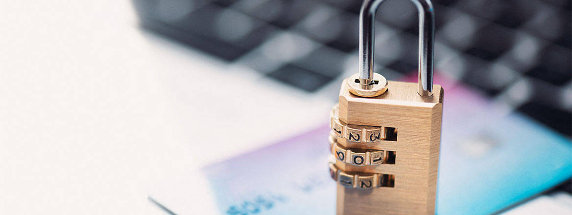 A padlock on a credit card on a computer