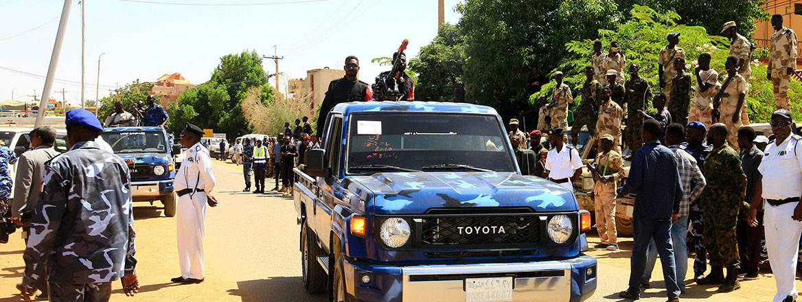 Keeping watch: armed police officers on patrol in an area controlled by the Sudanese Armed Forces in Omdurman, Sudan, on 26 October 2024