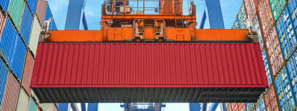 shipping crane moving red container