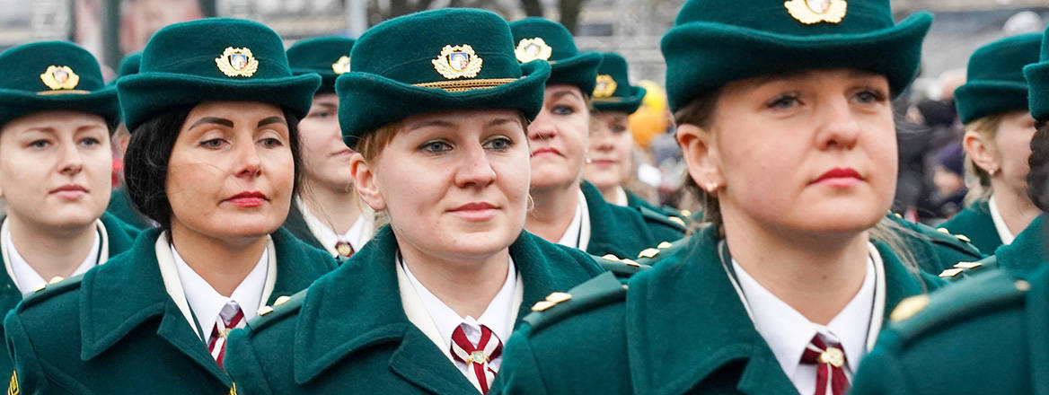 Women taking part in the Independence Day military parade in Riga, Latvia, in November 2019. The rapidly changing security environment in Europe has fostered debates in Latvia about the necessity of adding women to the draft system. Courtesy of Xinhua/Alamy