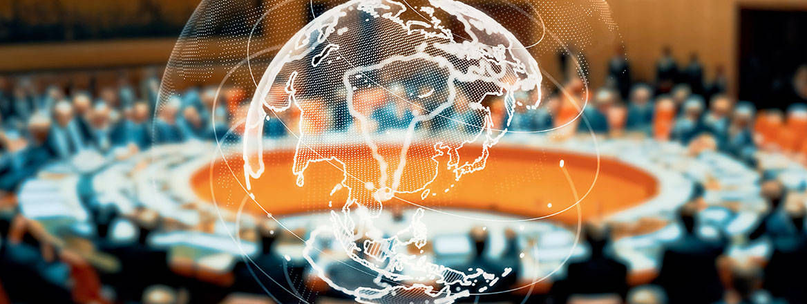 a round table at an international conference with world globe imposed on top
