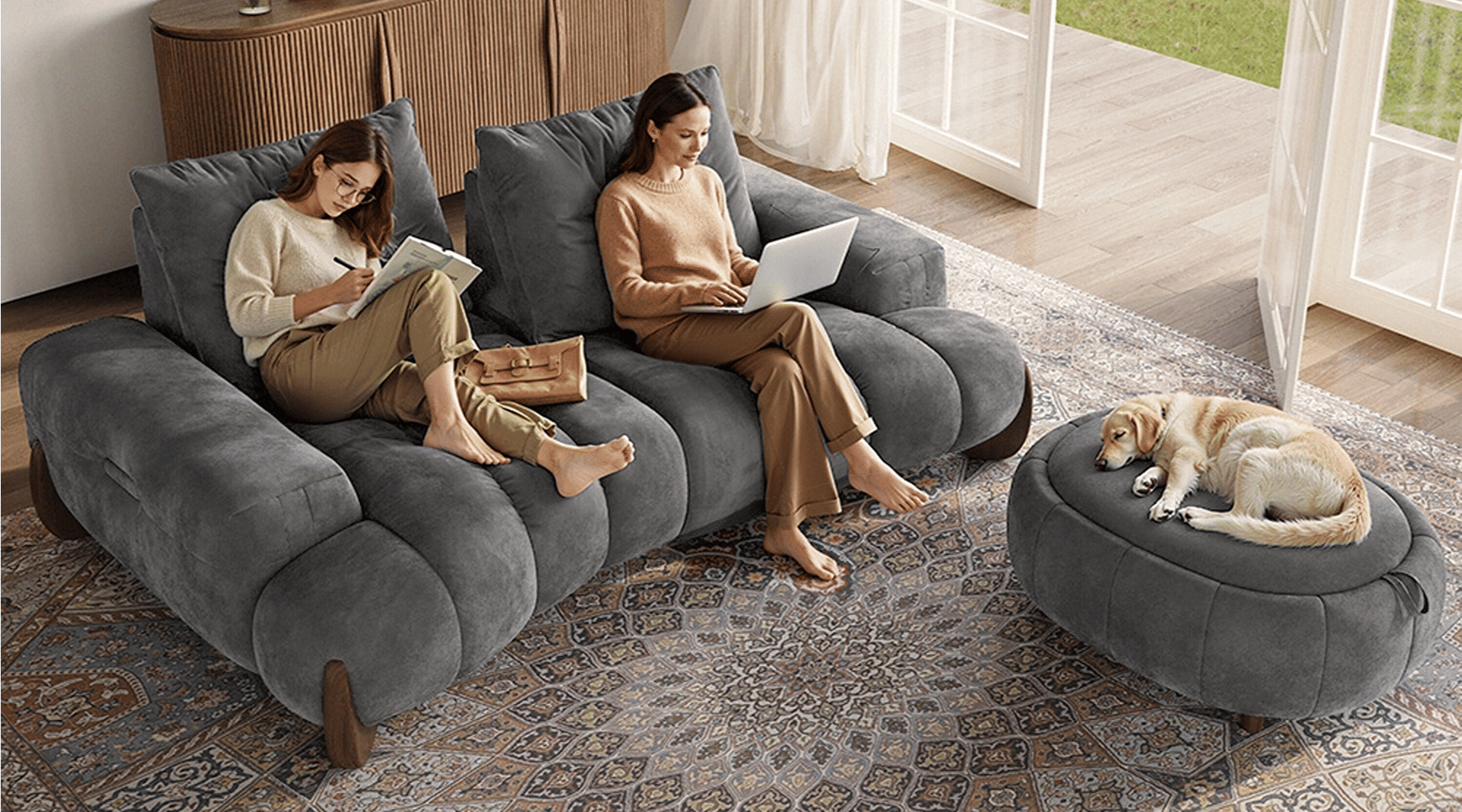 Two ladies lounge on an extra deep sofa that suitable for movie nights