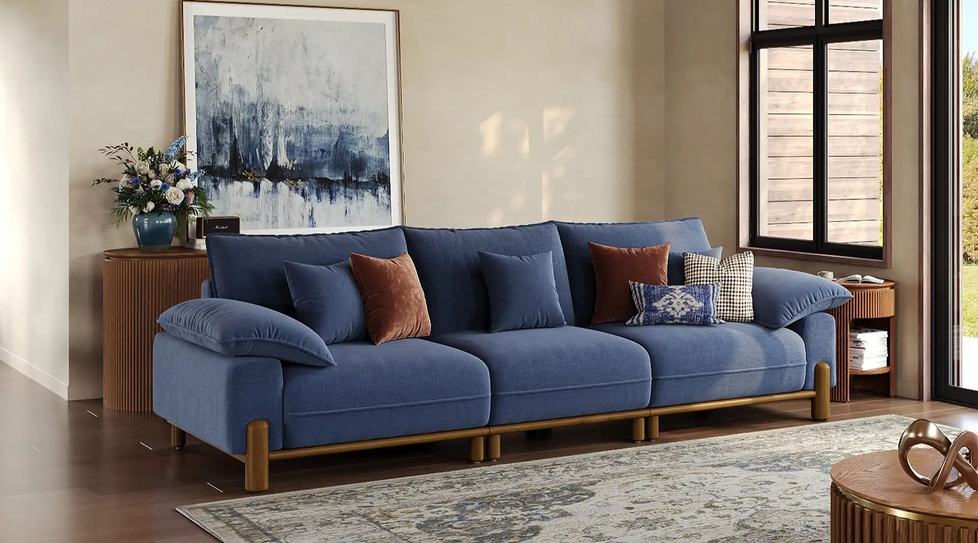 Navy blue sofa sets in a living room, pair with cream white walls and walnut furnitures