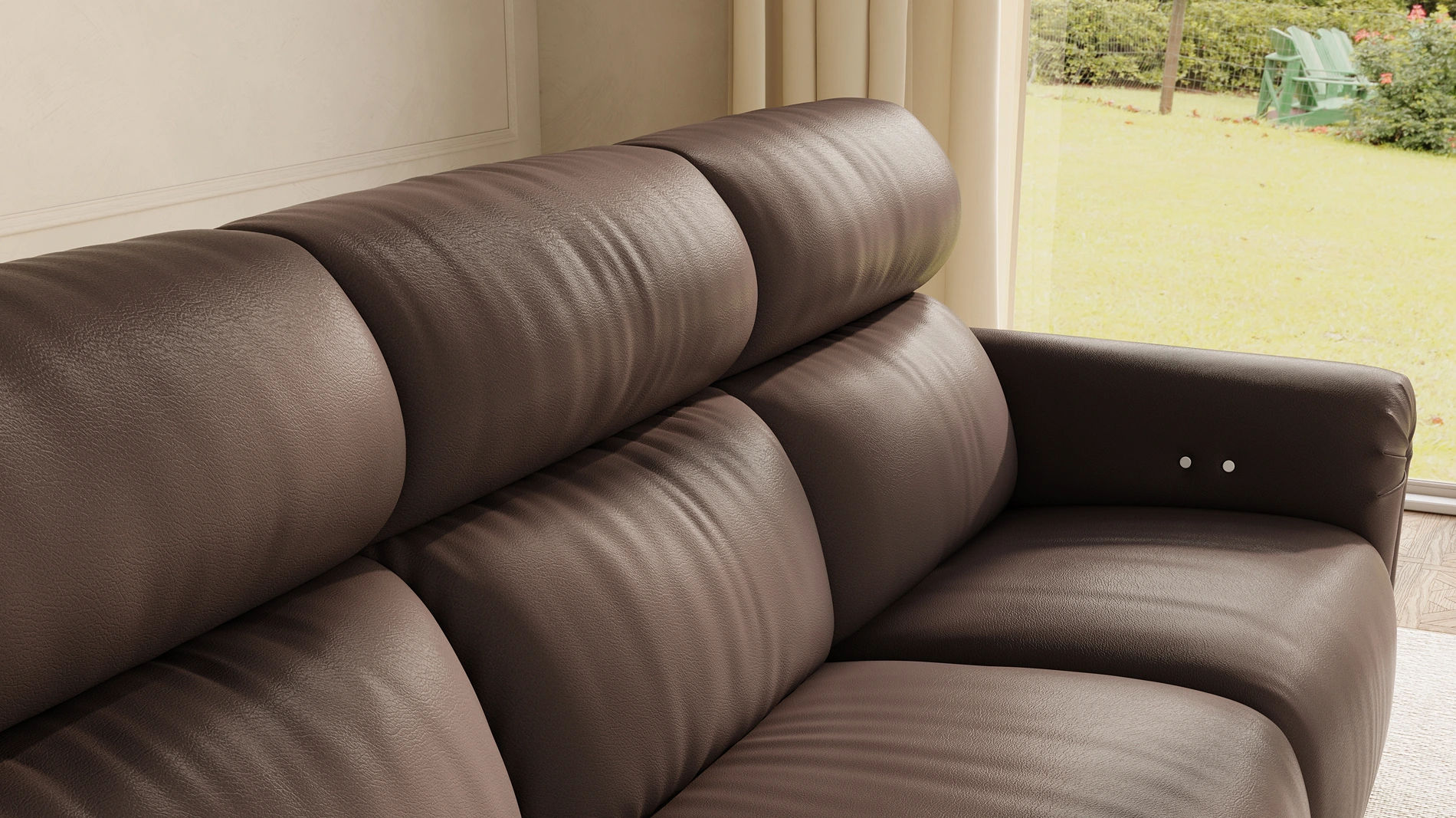 Close-up of a dark brown leather sofa with plush segmented back cushions, deep seating, and a built-in armrest control.