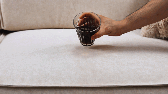 The liquid formed water droplets on the sofa fabric surface without penetrating.
