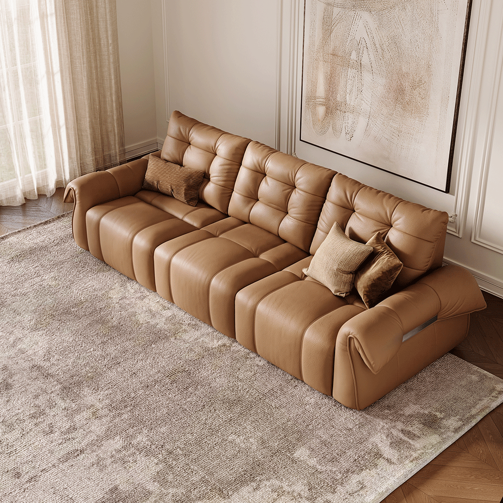 A modern leather upholstered sofa featuring deep seating and plush cushioning, showcasing versatile comfort options for lounging, stretching, or relaxing.