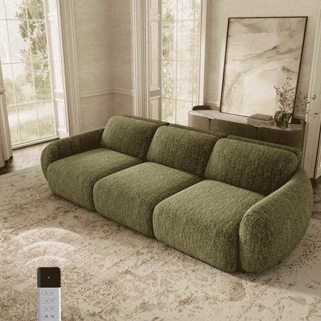 Green power sofa with remote control in a bright modern living room.