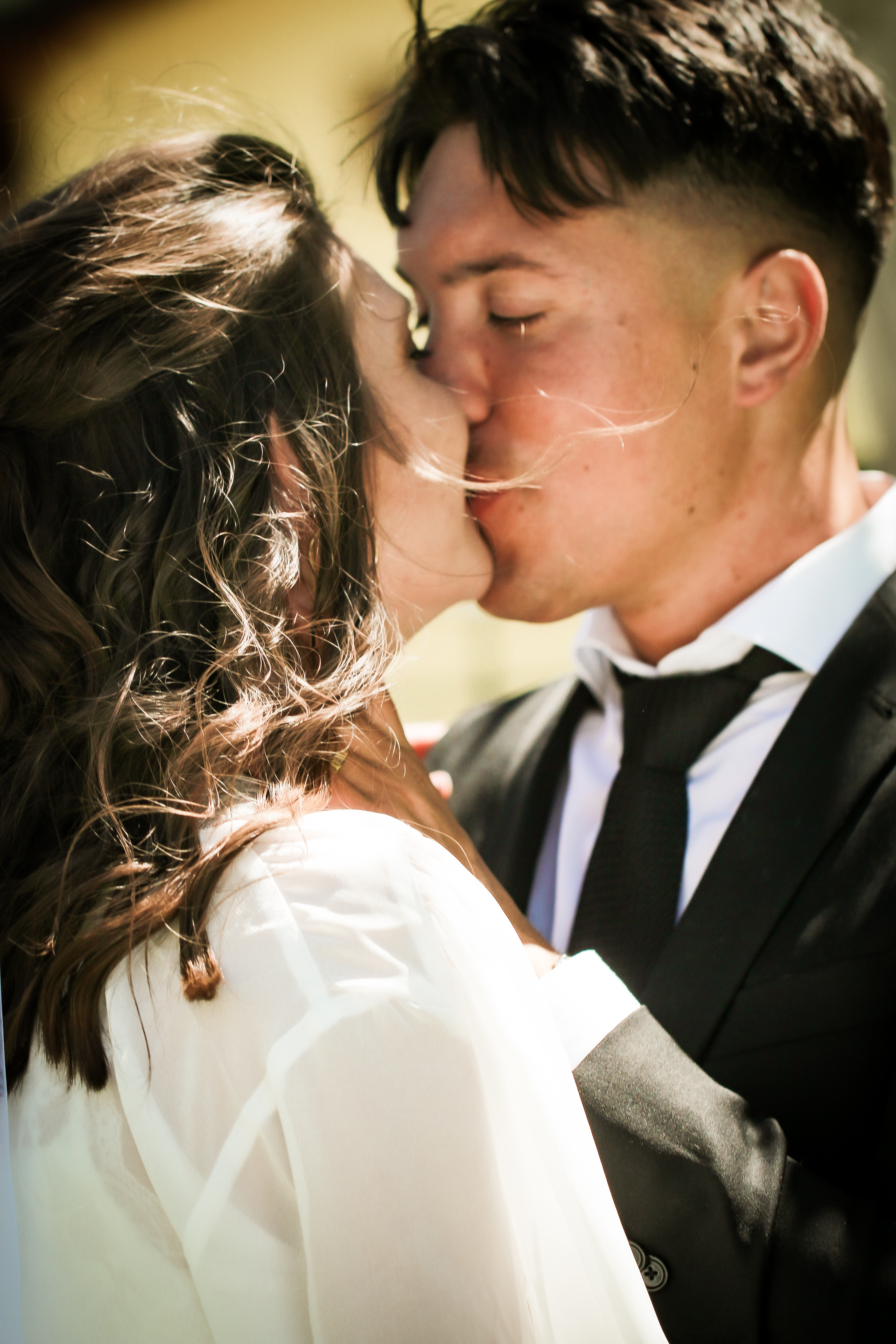 A quiet candid fleeting glance between couple inside an old Italian villa