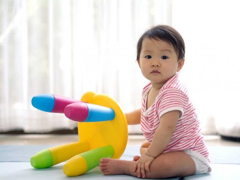 asian-cute-baby-sitting-playing-colorful-plastic-small-chair-soft-mat-home_78212-289.jpg