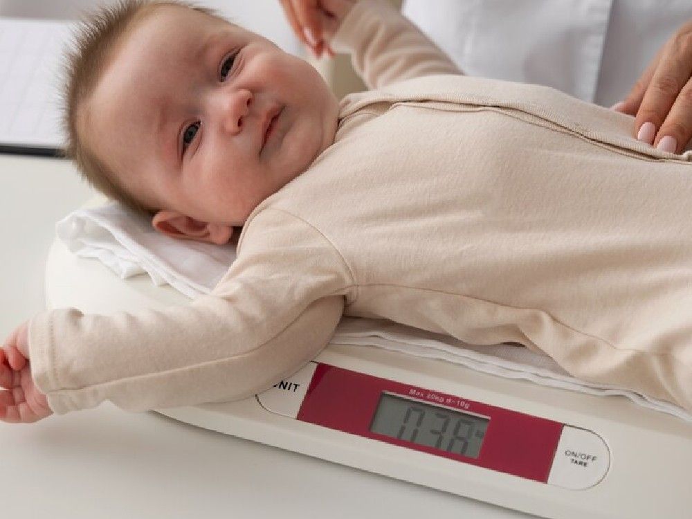 high-angle-baby-weighing-machine_23-2149728878.jpg