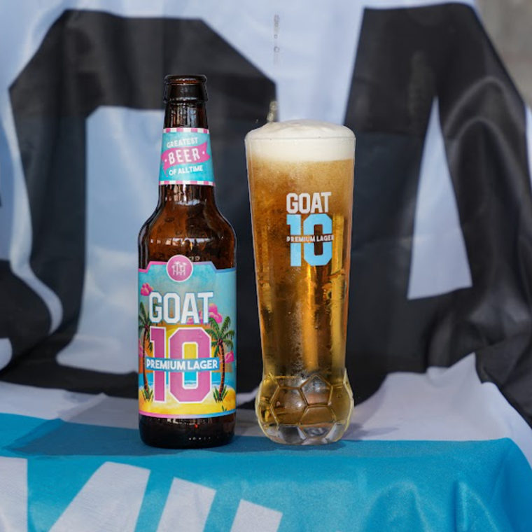 Prison Pals Pint Glass beside a GOAT 10 bottle