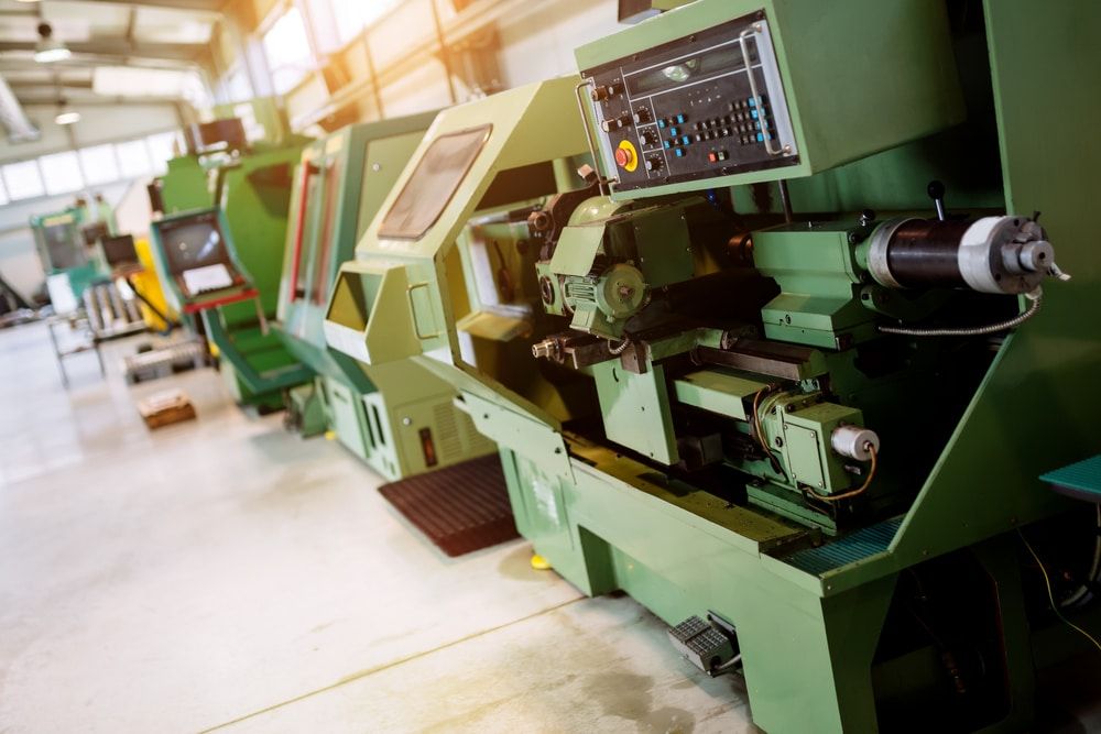 Why is it not reasonable to connect machines at the production hall to the manufacturing control system and production tracking software in small businesses?