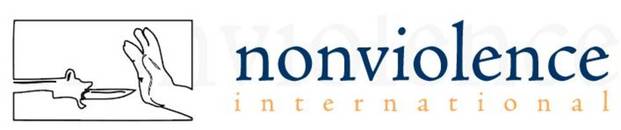 Nonviolence International Logo Hands held up against gun