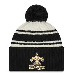 New Orleans Saints New Era 2022 Cream NFL Sideline Sport Pom Cuffed Knit Beanie Hat
